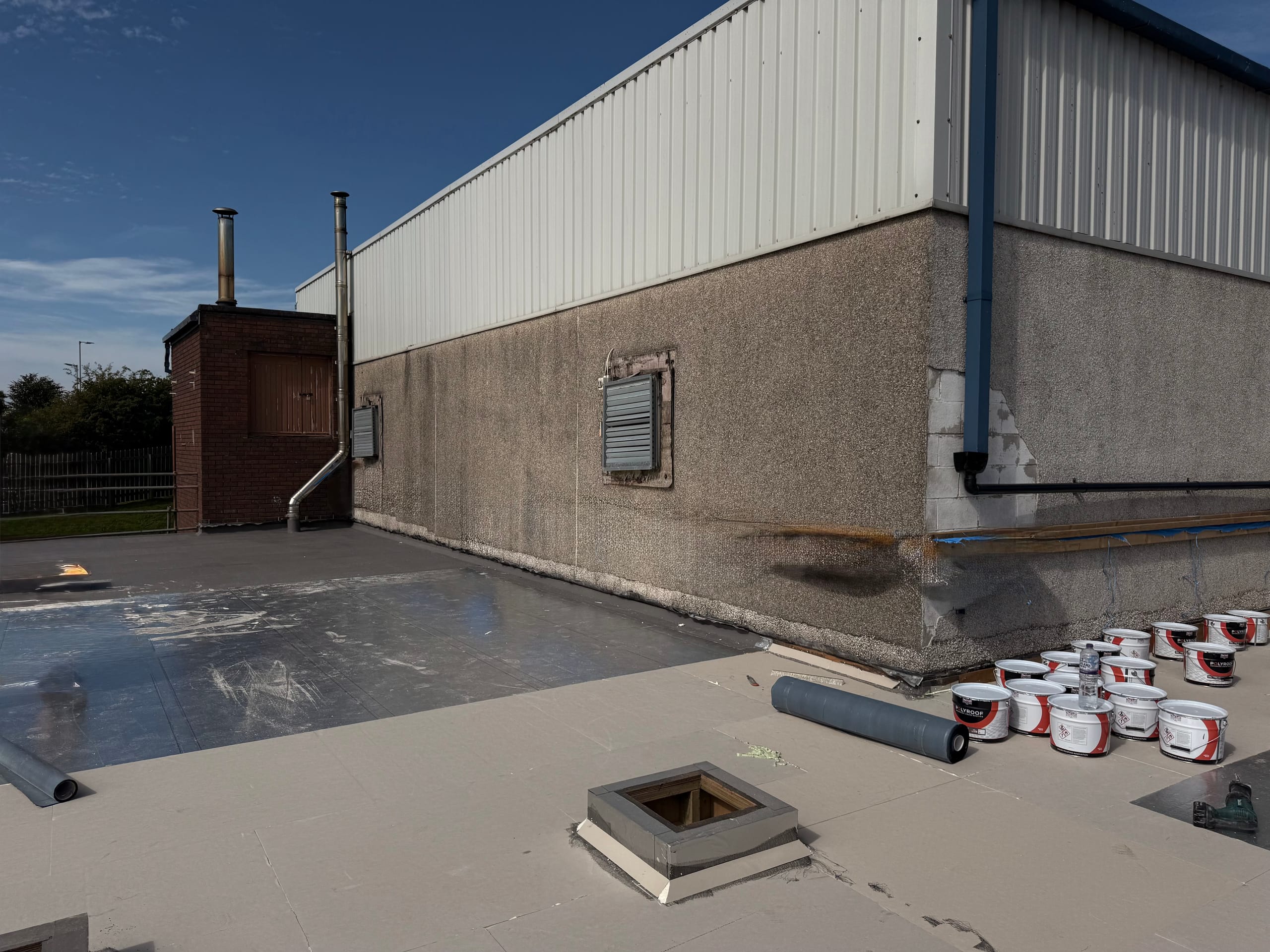 Louvre vents and services pipework on the Annan Academy building